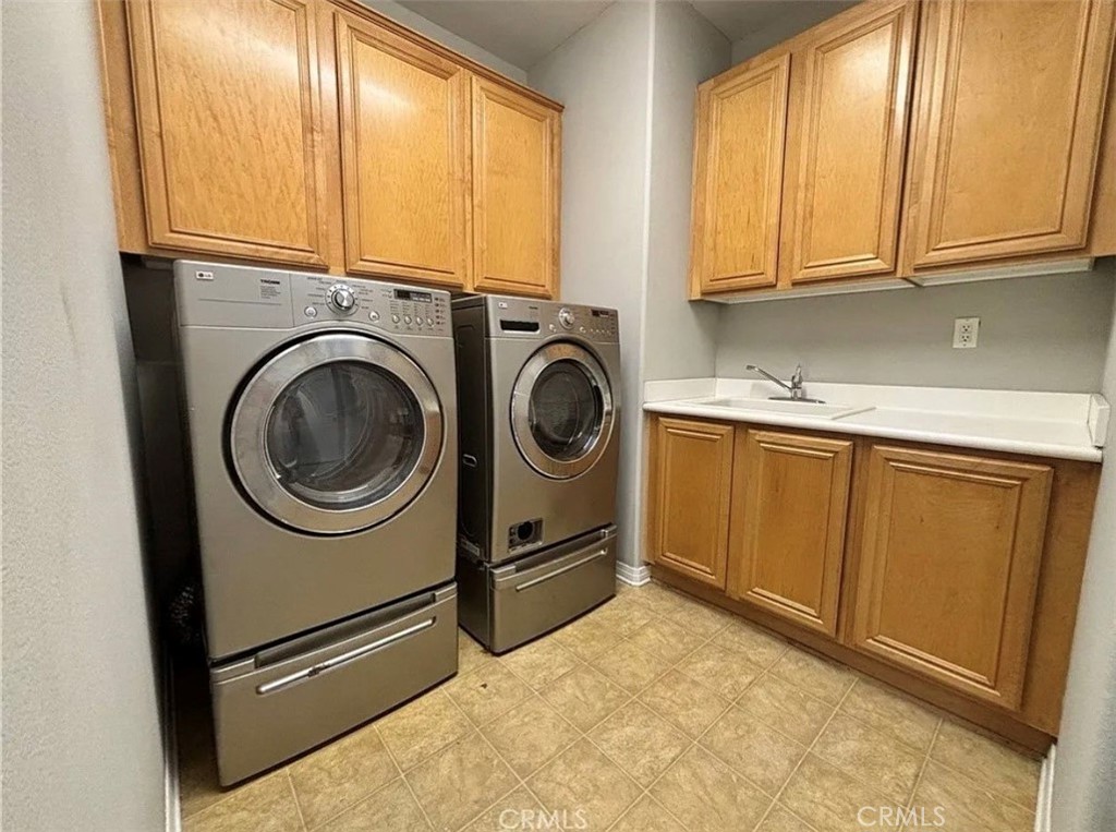 3715 Club Rancho Drive Palmdale, CA 93551 - Photo 27 of 52 a utility room with sink dryer and washer