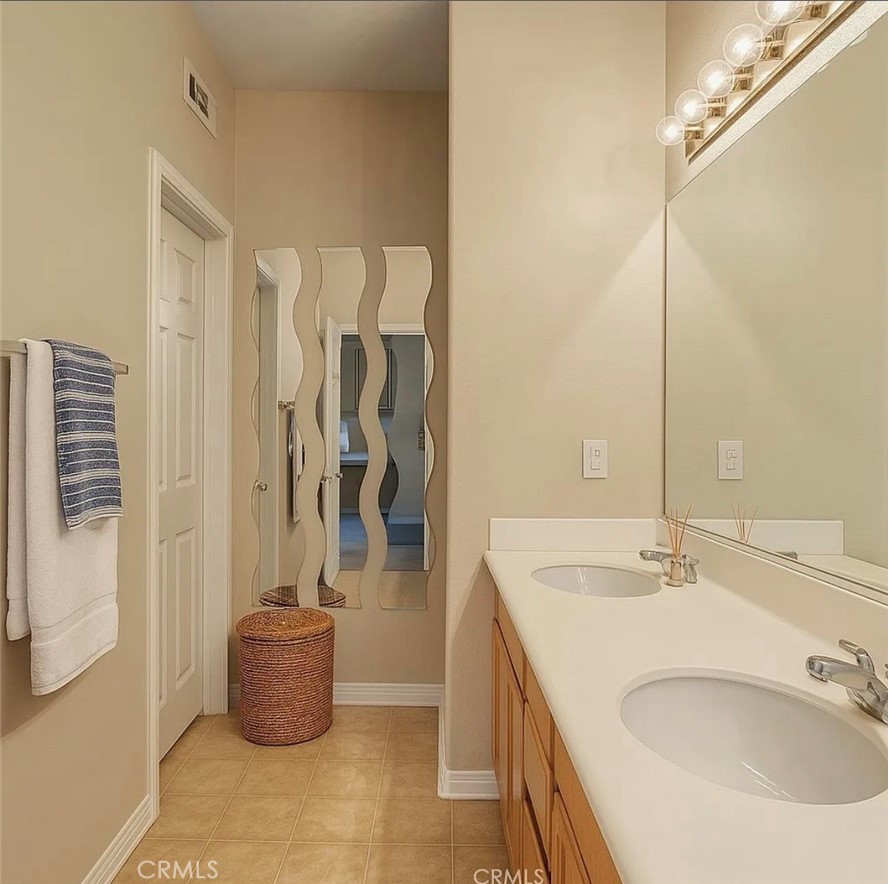 3715 Club Rancho Drive Palmdale, CA 93551 - Photo 37 of 52 a bathroom with a sink and a mirror