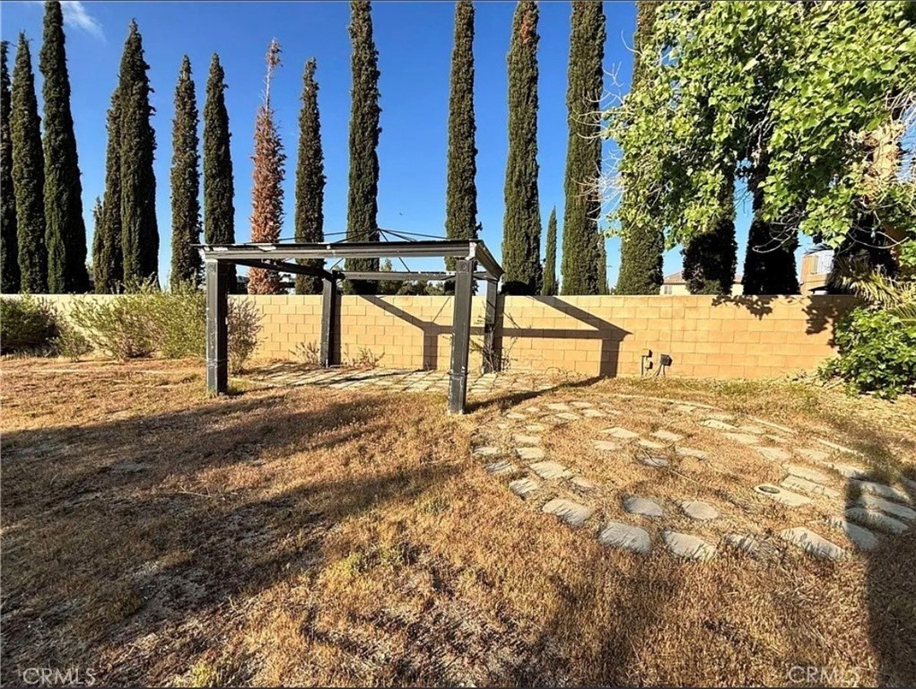 3715 Club Rancho Drive Palmdale, CA 93551 - Photo 45 of 52 a view of a yard with trees
