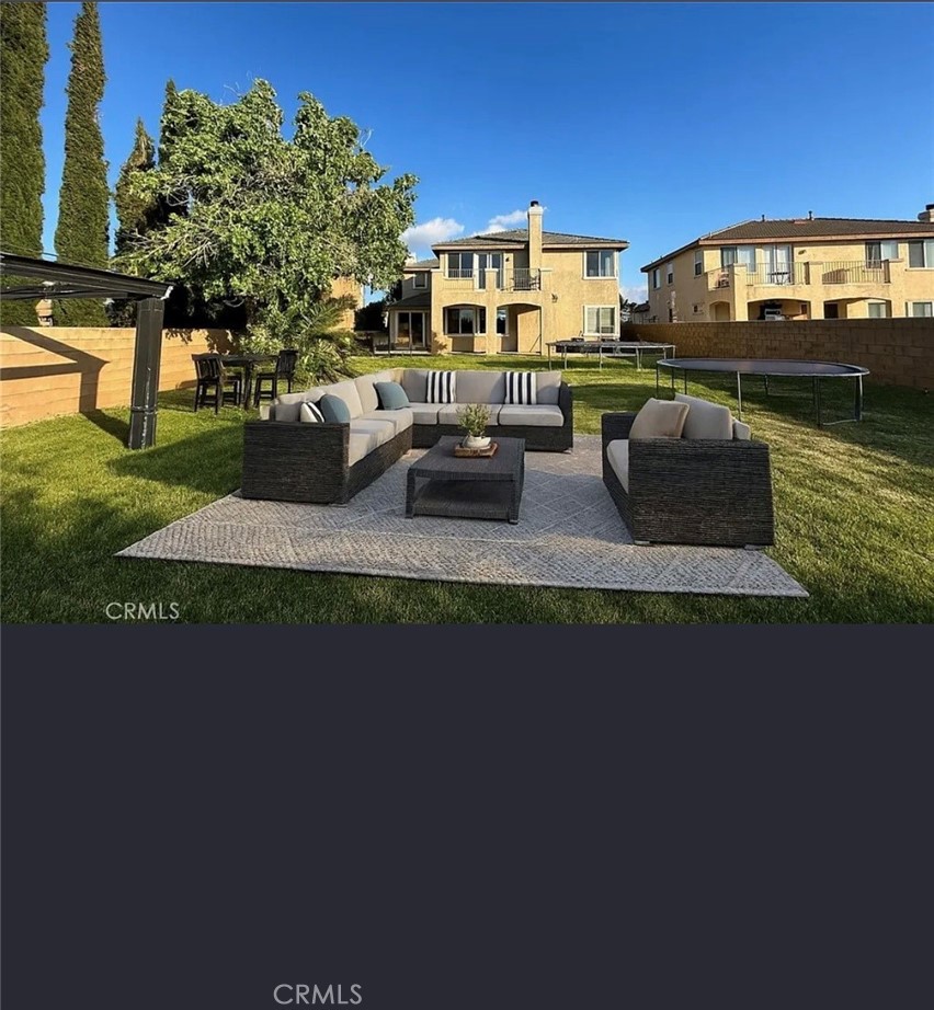 3715 Club Rancho Drive Palmdale, CA 93551 - Photo 48 of 52 a view of a house with a yard
