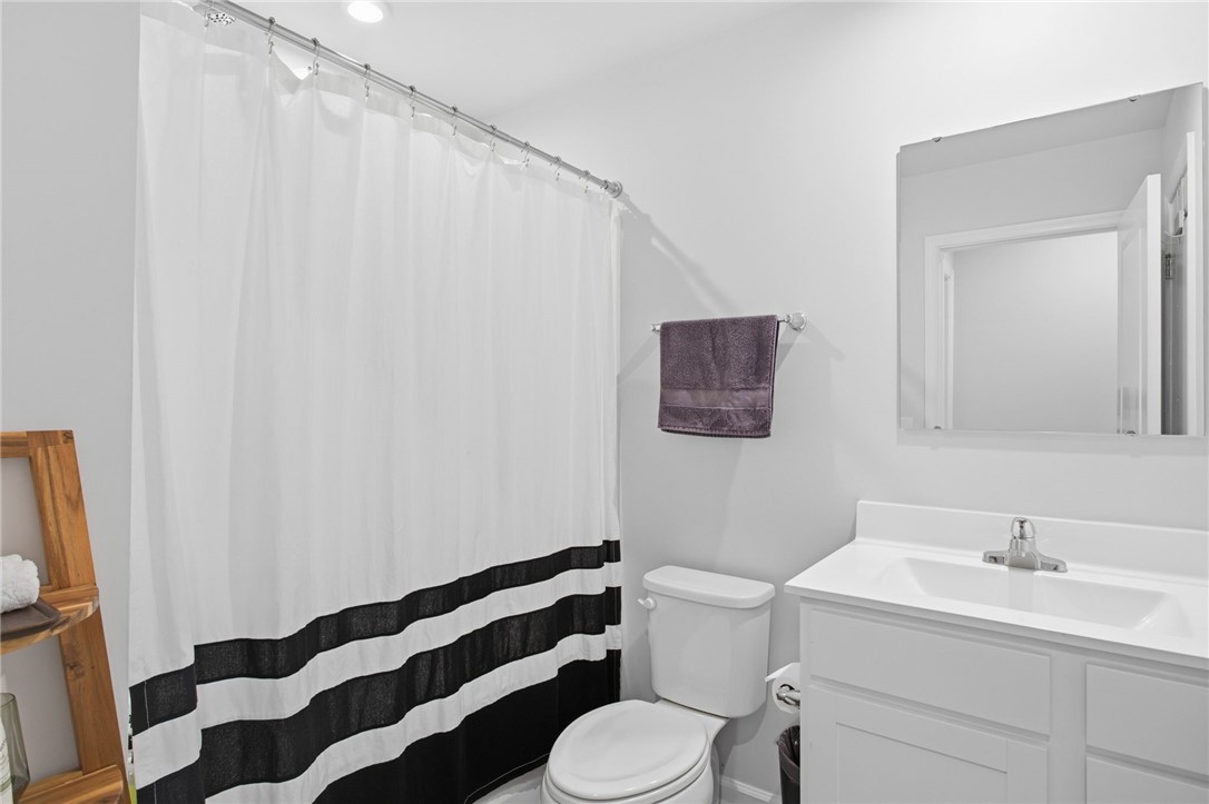 112 Wls Sta Road Seneca, SC 29678 - Photo 31 of 42 Crisp white finishes and recessed lighting create a clean aesthetic in this modern bathroom.