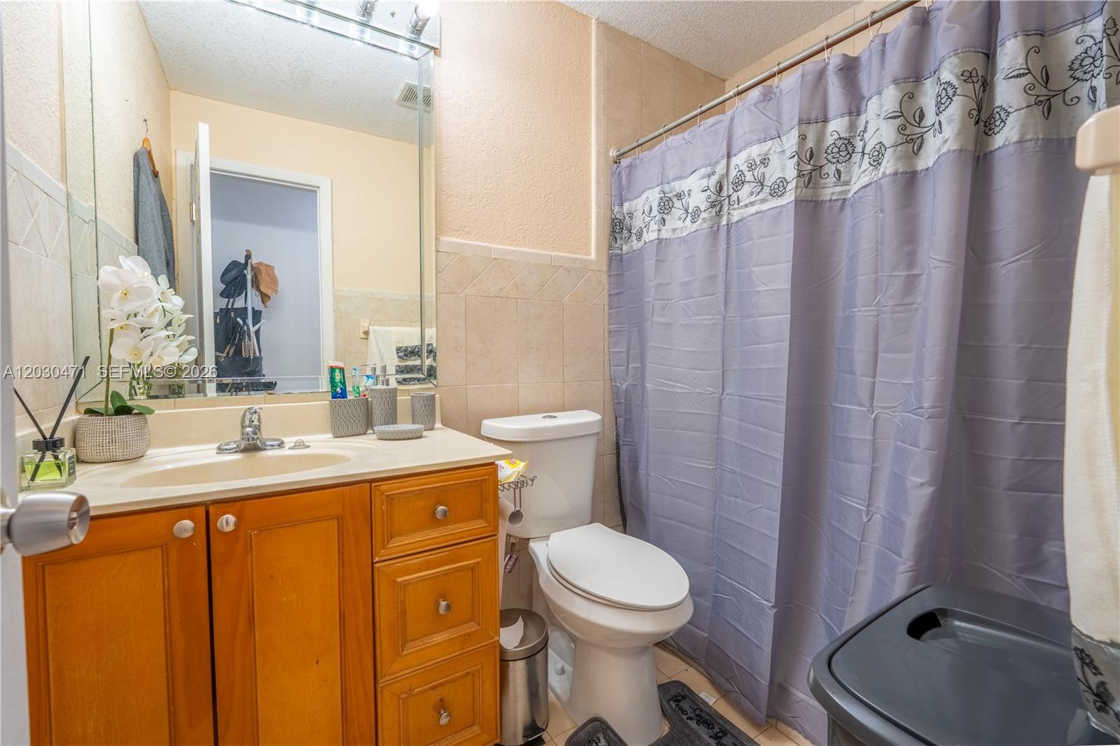 11851 Southwest 181st Street Miami, FL 33177 - Photo 21 of 25 a bathroom with a granite countertop sink toilet and shower