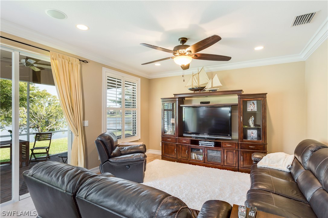 8517 Sumner Avenue Fort Myers, FL 33908 - Photo 12 of 25 a living room with furniture and a flat screen tv