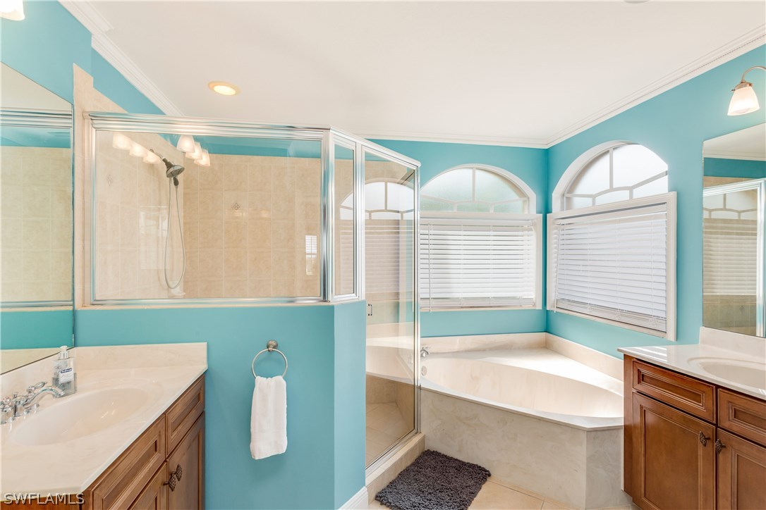 8517 Sumner Avenue Fort Myers, FL 33908 - Photo 19 of 25 a bathroom with a tub sink and mirror