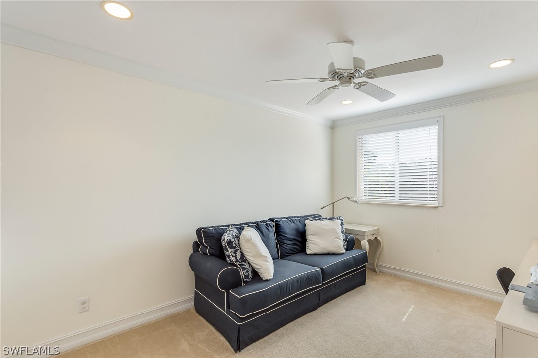 8517 Sumner Avenue Fort Myers, FL 33908 - Photo 22 of 25 a living room with furniture and a ceiling fan