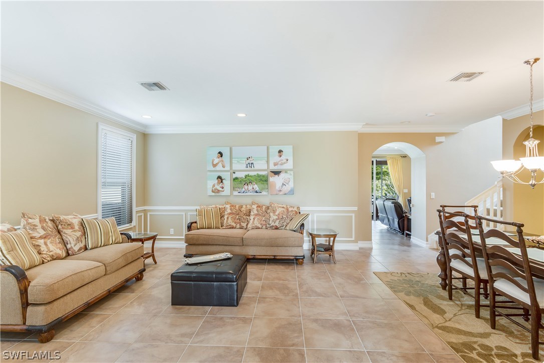 8517 Sumner Avenue Fort Myers, FL 33908 - Photo 3 of 25 a living room with furniture and wooden floor