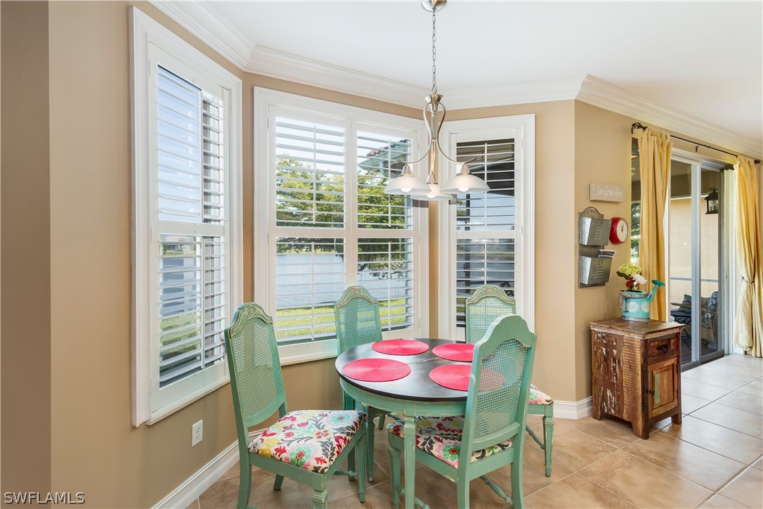 8517 Sumner Avenue Fort Myers, FL 33908 - Photo 10 of 25 a view of a dining room with furniture window and outside view