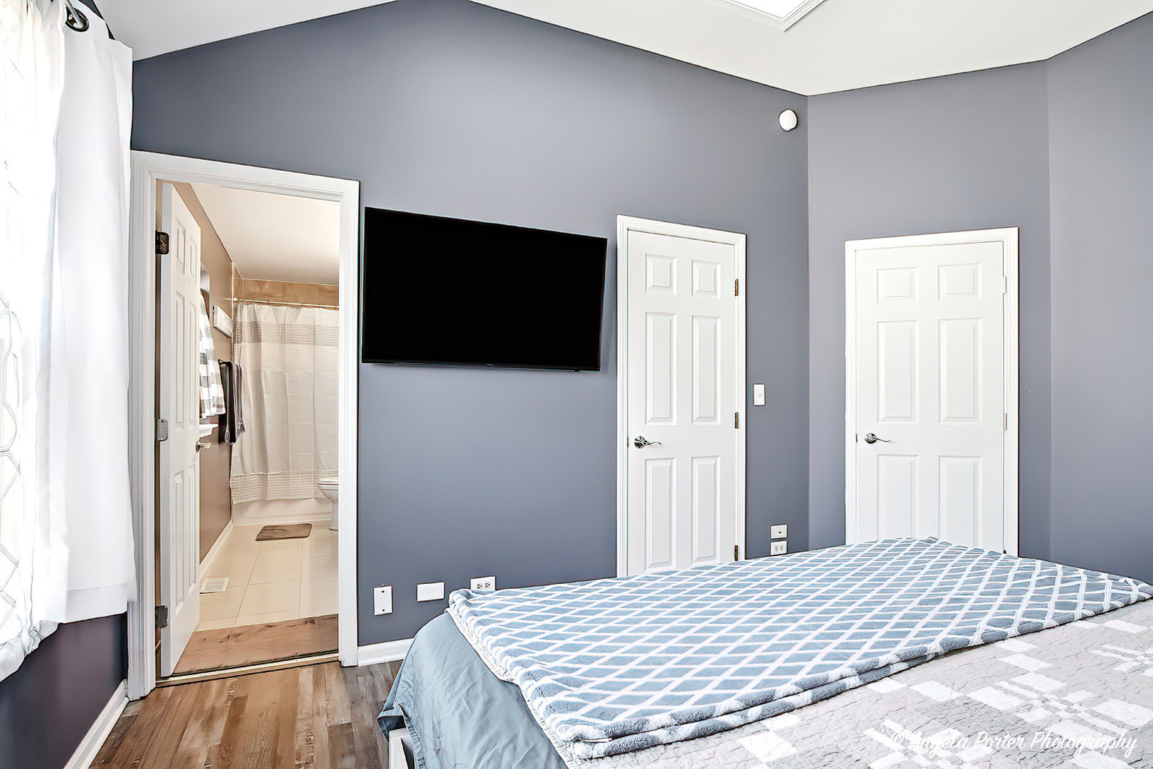 2019 Aspen Drive Woodstock, IL 60098 - Photo 15 of 31 a bedroom with a bed and a flat screen tv