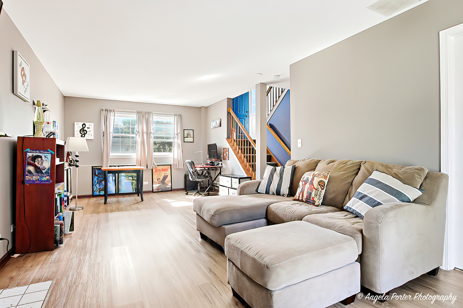 2019 Aspen Drive Woodstock, IL 60098 - Photo 21 of 31 a living room with furniture and a wooden floor