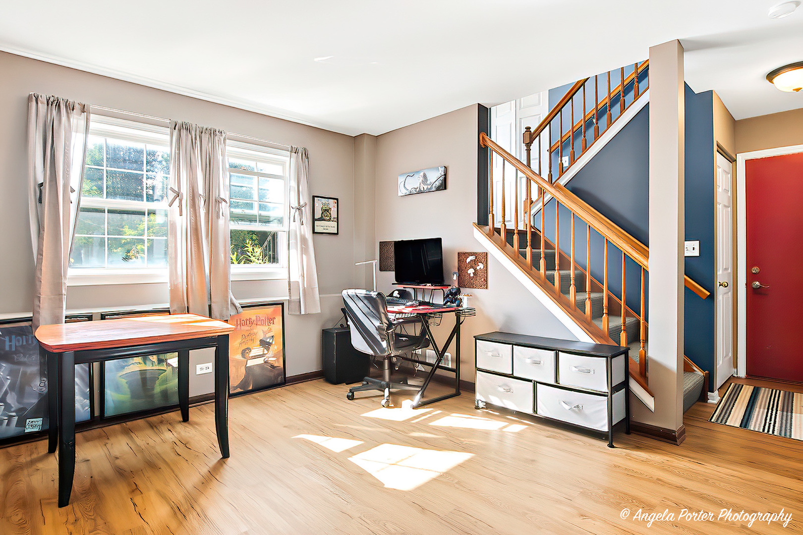 2019 Aspen Drive Woodstock, IL 60098 - Photo 24 of 31 a living room with furniture a flat screen tv and a window
