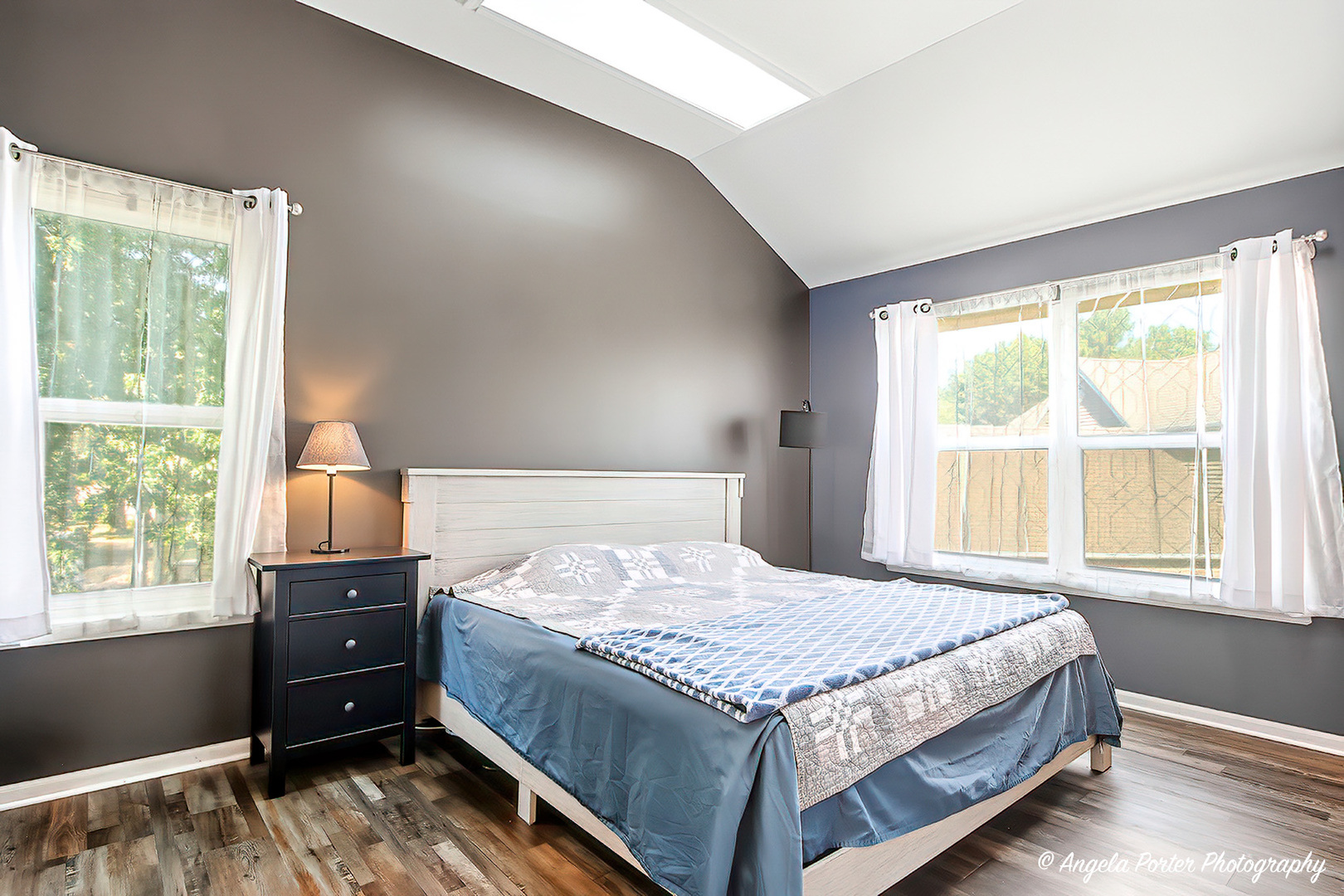 2019 Aspen Drive Woodstock, IL 60098 - Photo 4 of 31 a bedroom with a bed and a tv