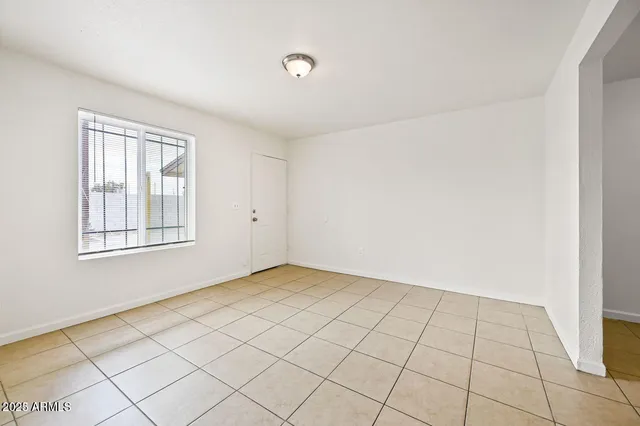 a kitchen with a refrigerator and a stove