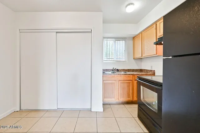 a kitchen with stainless steel appliances granite countertop a stove and a refrigerator