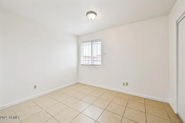 a bathroom with a granite countertop sink toilet a mirror and bathtub