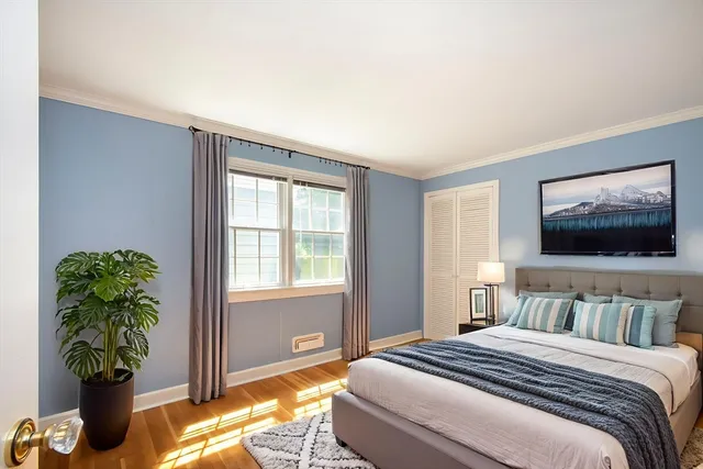 a bedroom with bed and a window