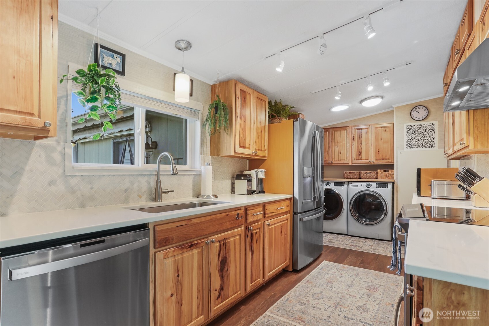 23716 9th Place West Bothell, WA 98021 - Photo 16 of 40 a view of a kitchen with a sink washer and dryer