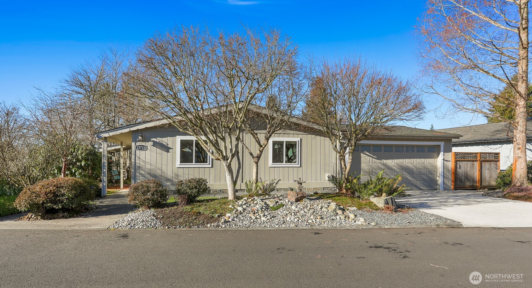 23716 9th Place West Bothell, WA 98021 - Photo 3 of 40 a front view of a house with garden