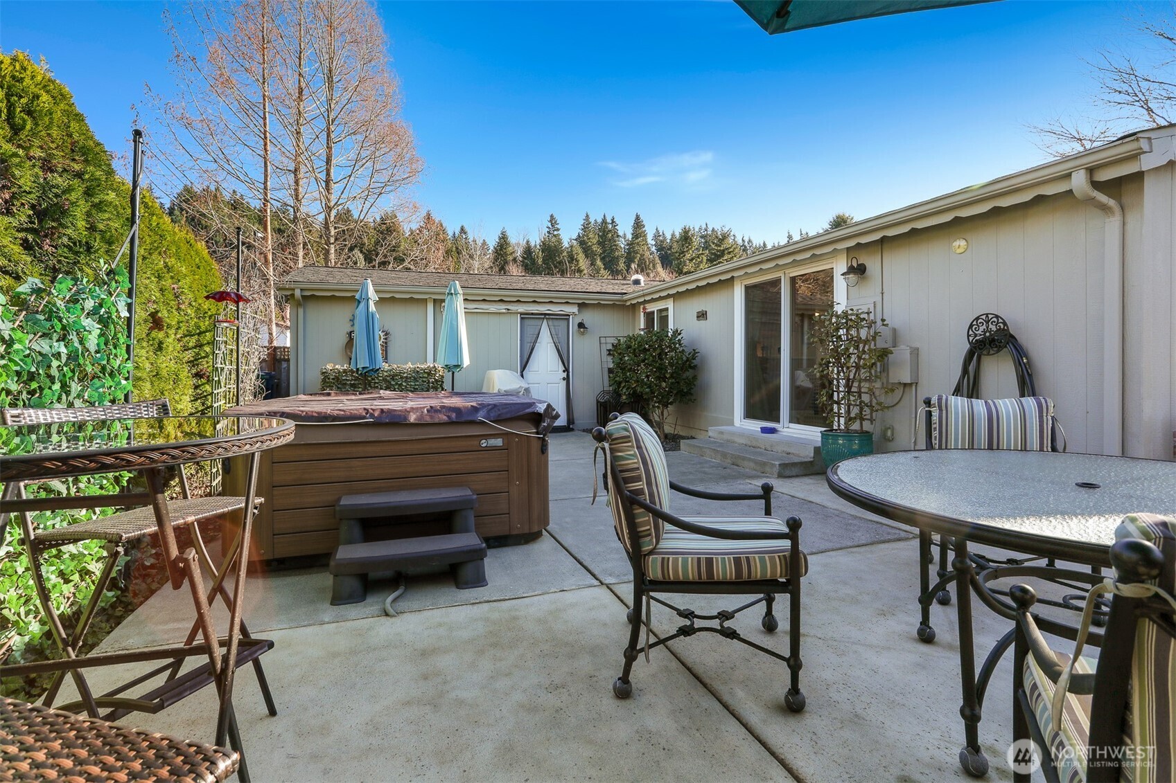 23716 9th Place West Bothell, WA 98021 - Photo 37 of 40 a view of a patio with a table chairs and barbeque grill