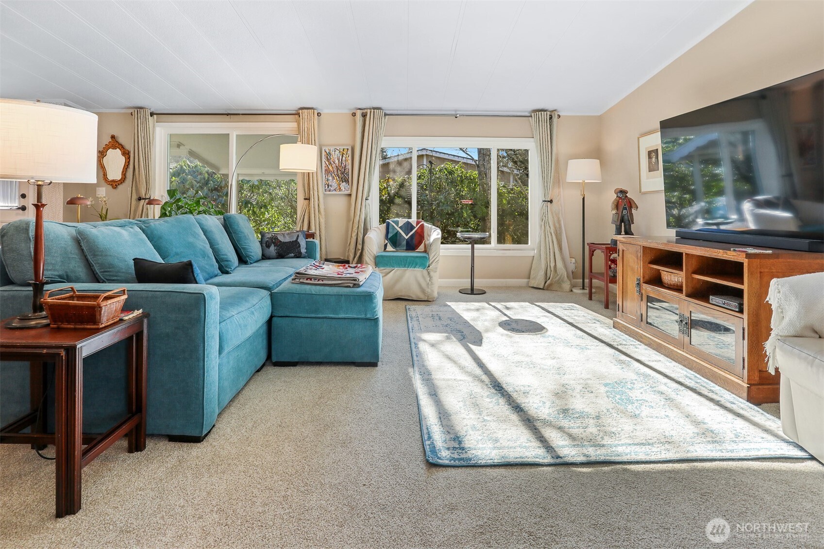 23716 9th Place West Bothell, WA 98021 - Photo 10 of 40 a living room with furniture and a flat screen tv