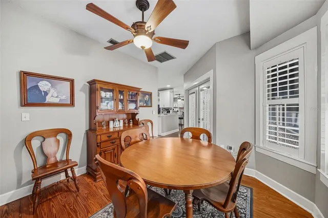 a dining room with furniture and window