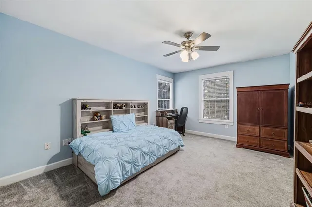 a bedroom with a bed and a closet