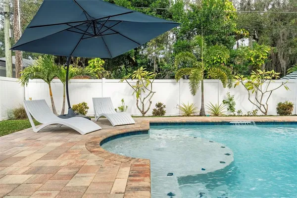 a view of a swimming pool with a patio