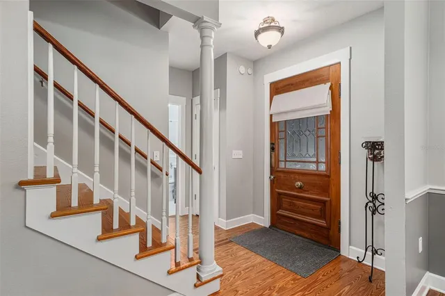 a view of entryway and hall with a front door