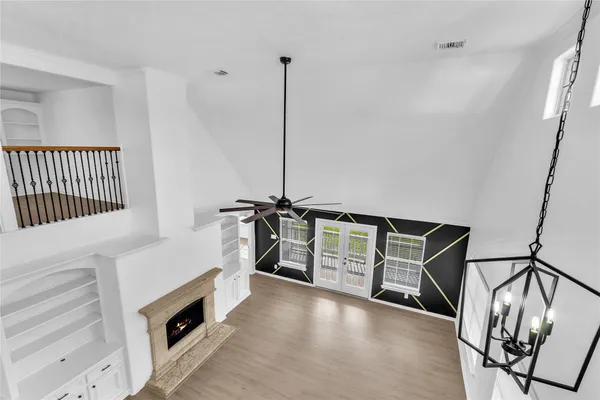 a view of a hallway with stairs