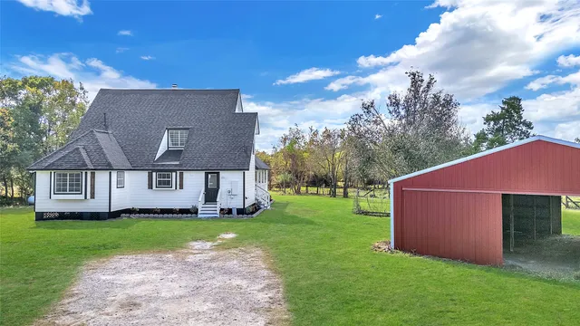 a front view of house with yard and green space