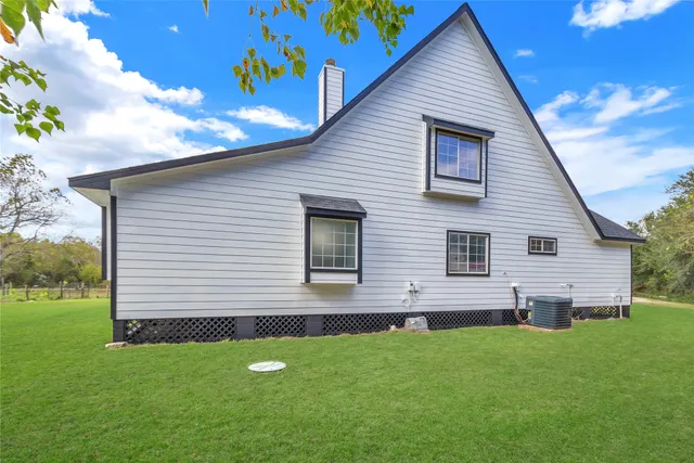 a backyard of a house with lots of green space