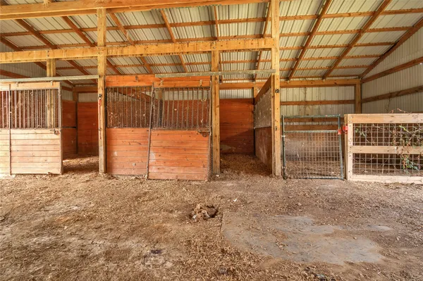 a view of a room with wooden walls
