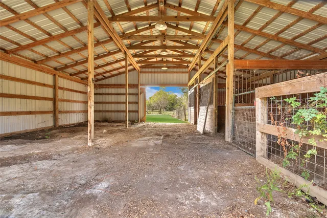a view of a room with wooden walls