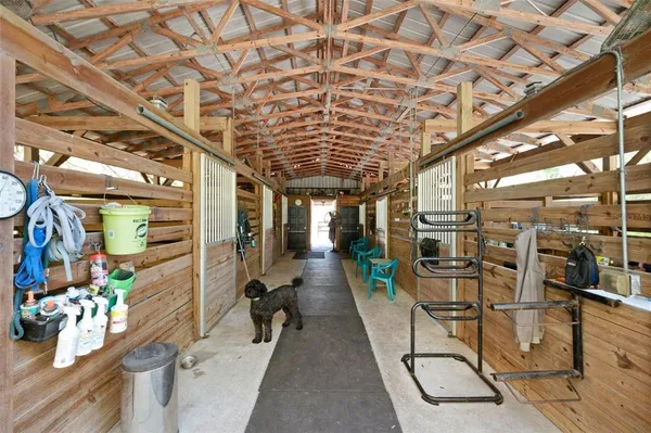 a view of a yard with wooden fence