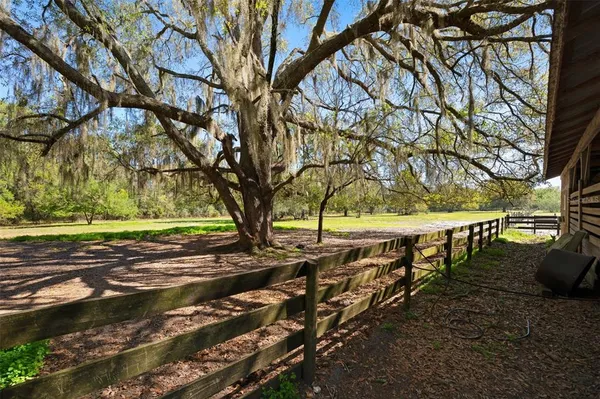 a view of a backyard with sitting area