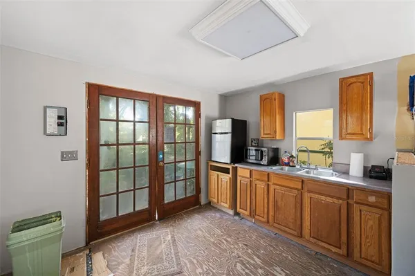 a living room with furniture a dining table and a flat screen tv