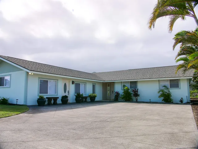an aerial view of a house with outdoor space and lake view