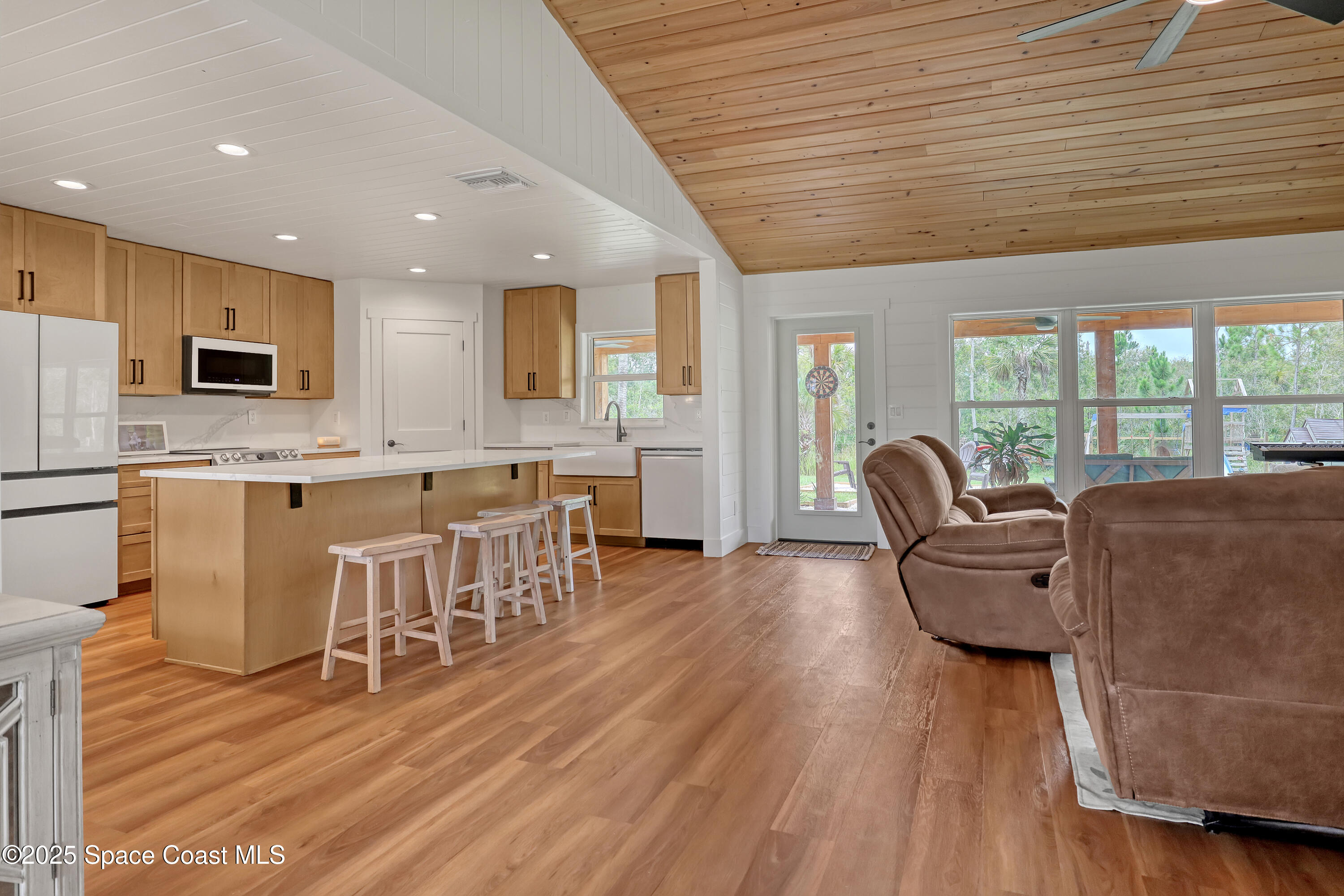 3350 Leghorn Road Malabar, FL 32950 - Photo 11 of 55 a living room with furniture and a wooden floor