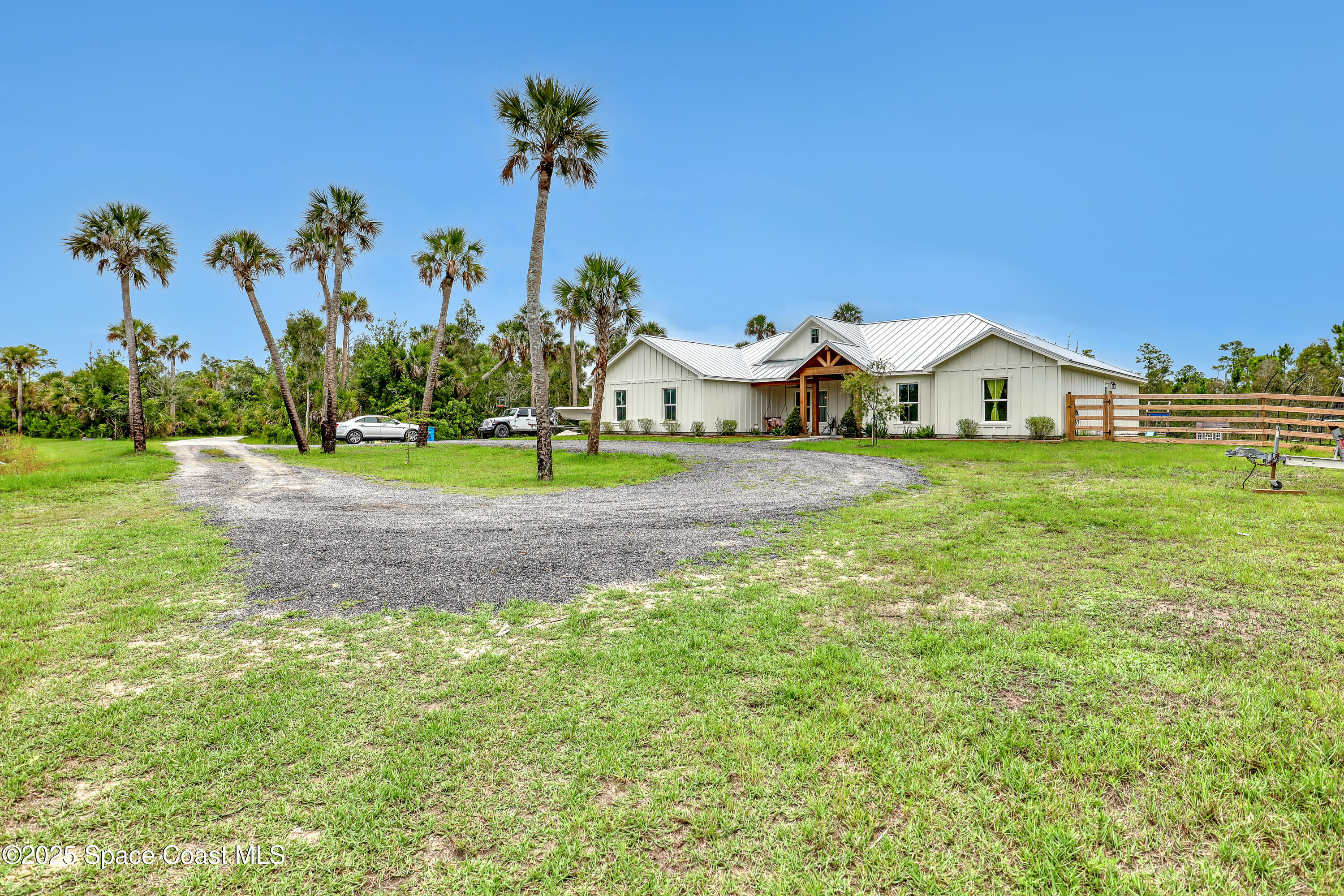 3350 Leghorn Road Malabar, FL 32950 - Photo 2 of 55 a front view of a house with garden