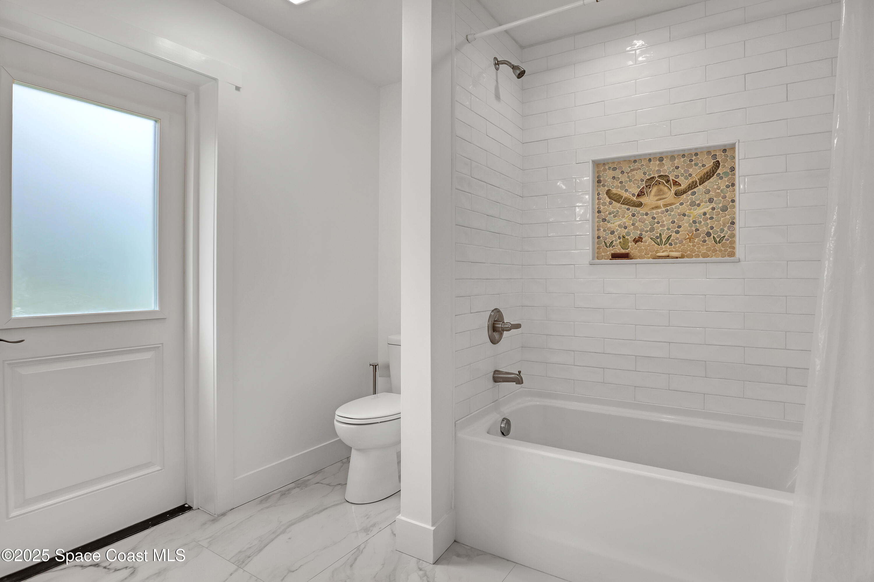 3350 Leghorn Road Malabar, FL 32950 - Photo 27 of 55 a bathroom with a toilet a sink and bathtub