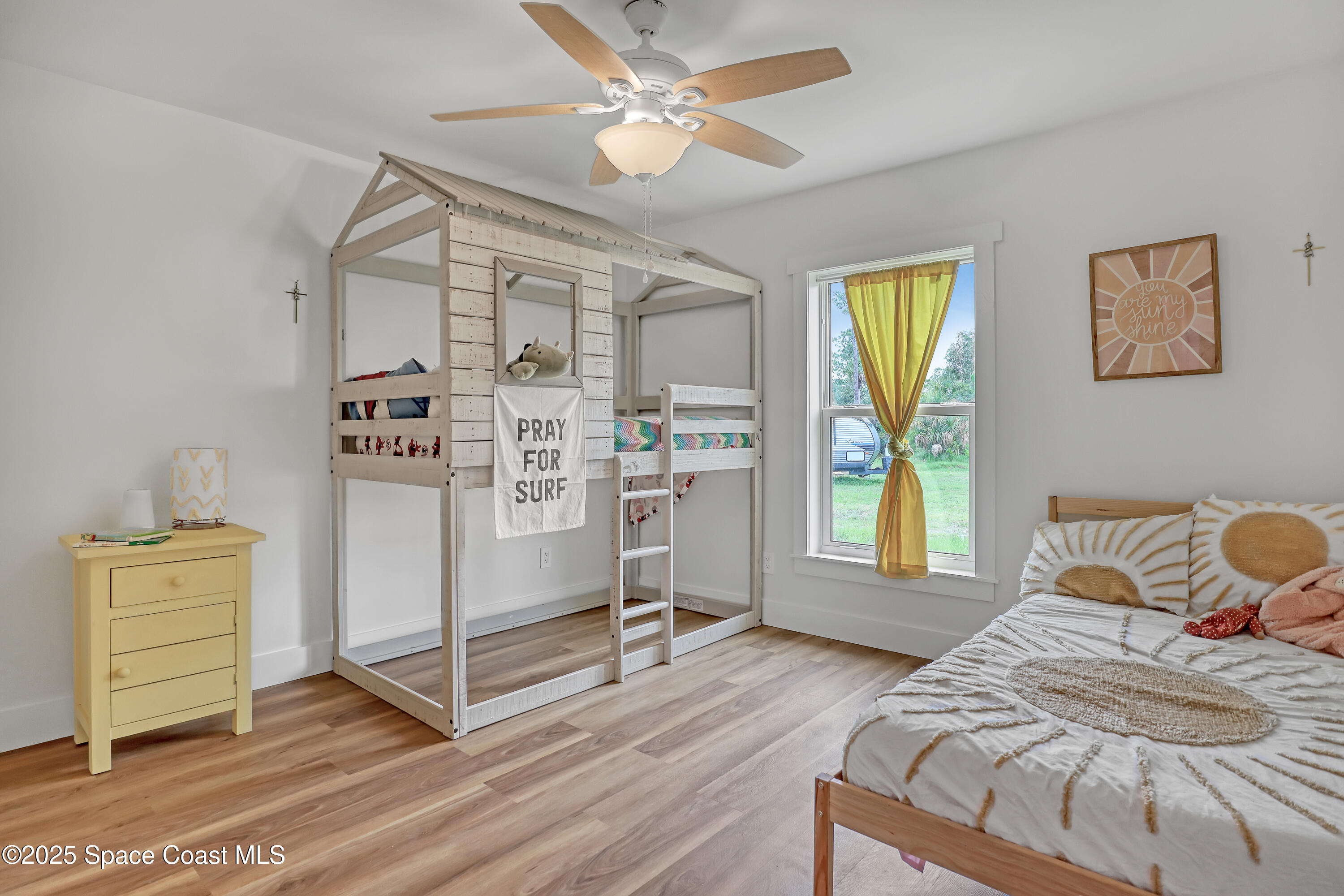 3350 Leghorn Road Malabar, FL 32950 - Photo 29 of 55 a bedroom with a bed and a window