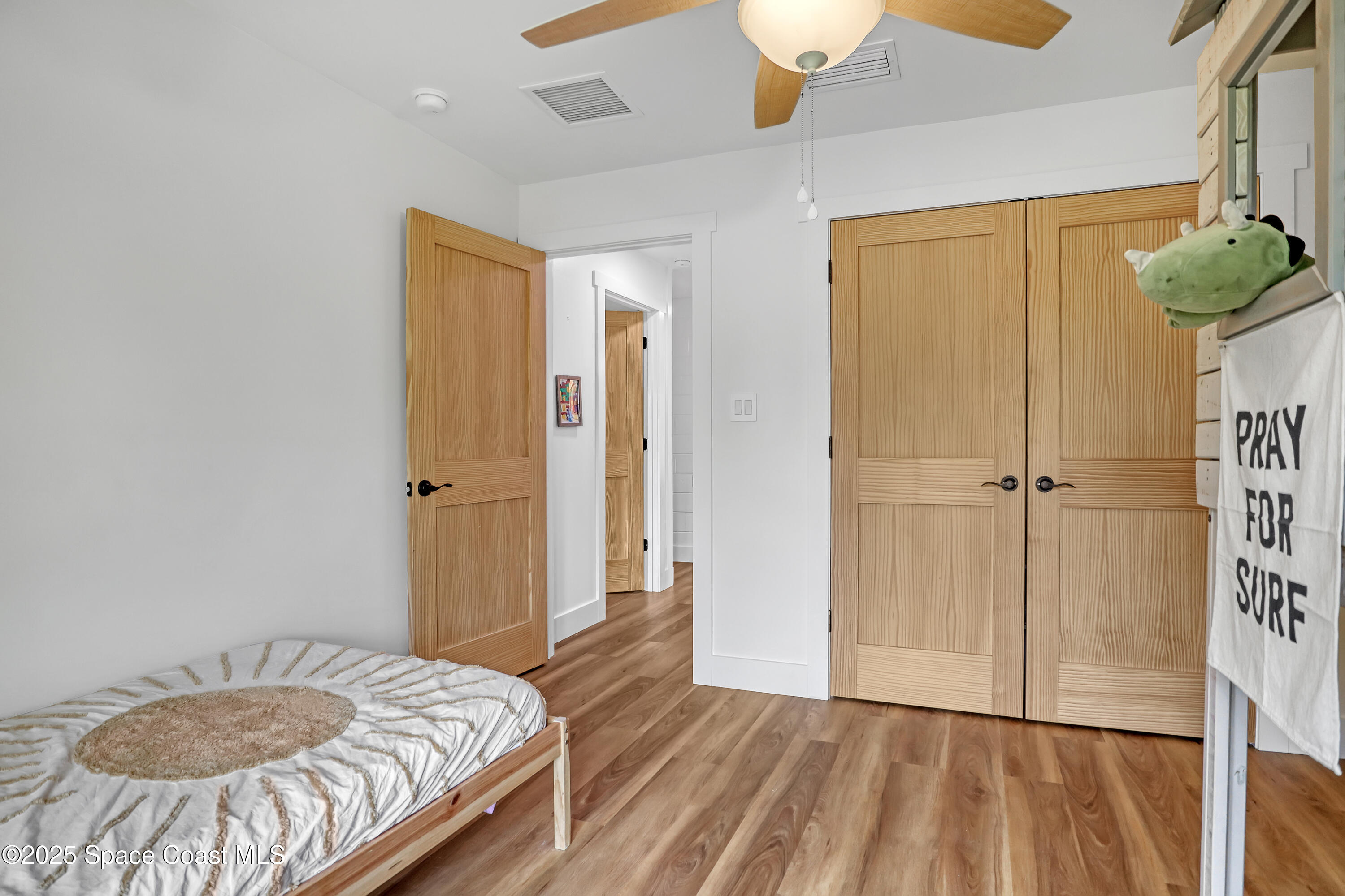 3350 Leghorn Road Malabar, FL 32950 - Photo 30 of 55 a bedroom with a bed and a table