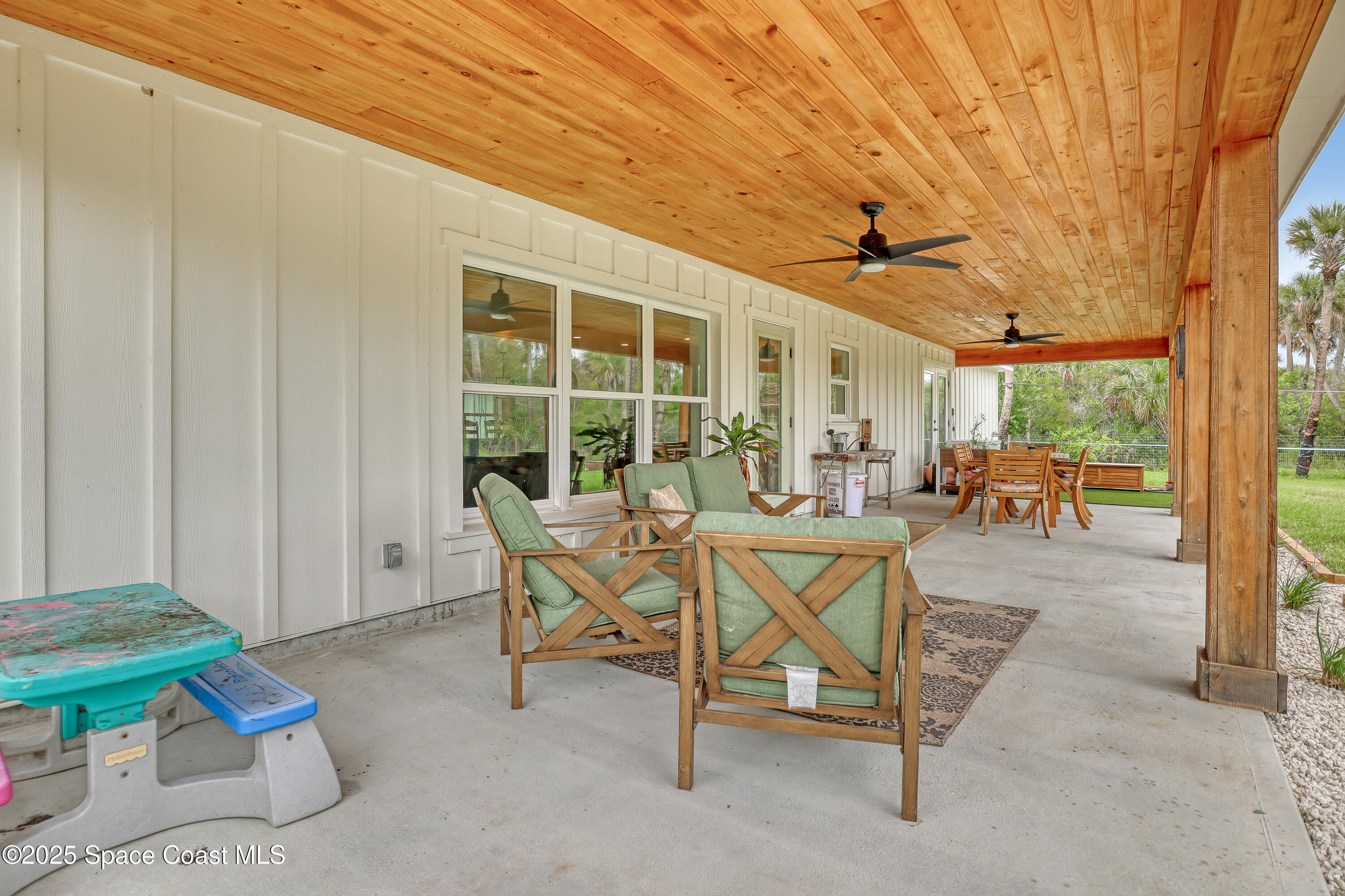 3350 Leghorn Road Malabar, FL 32950 - Photo 33 of 55 a view of a patio with table and chairs
