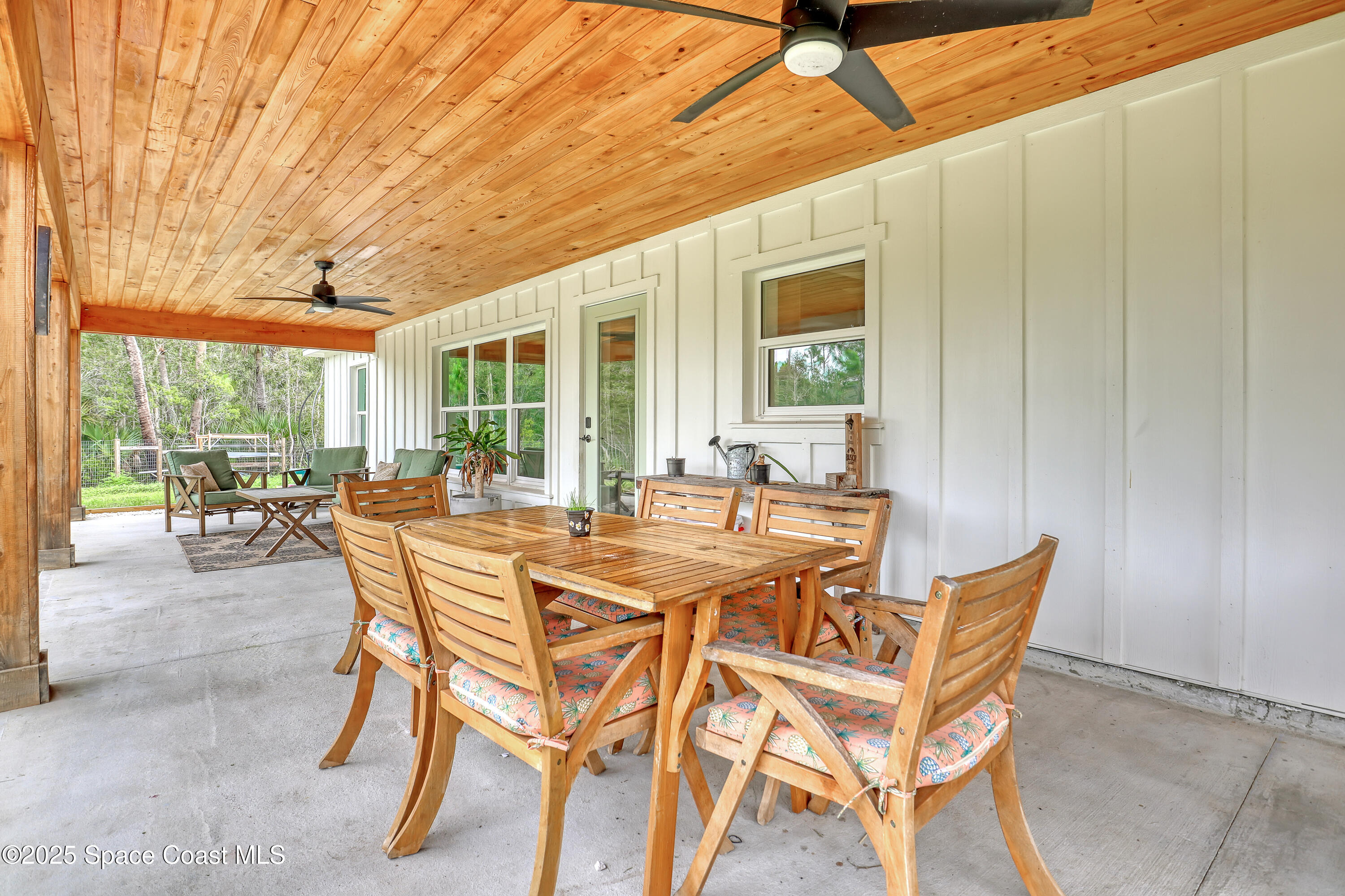 3350 Leghorn Road Malabar, FL 32950 - Photo 36 of 55 a view of a patio with table and chairs