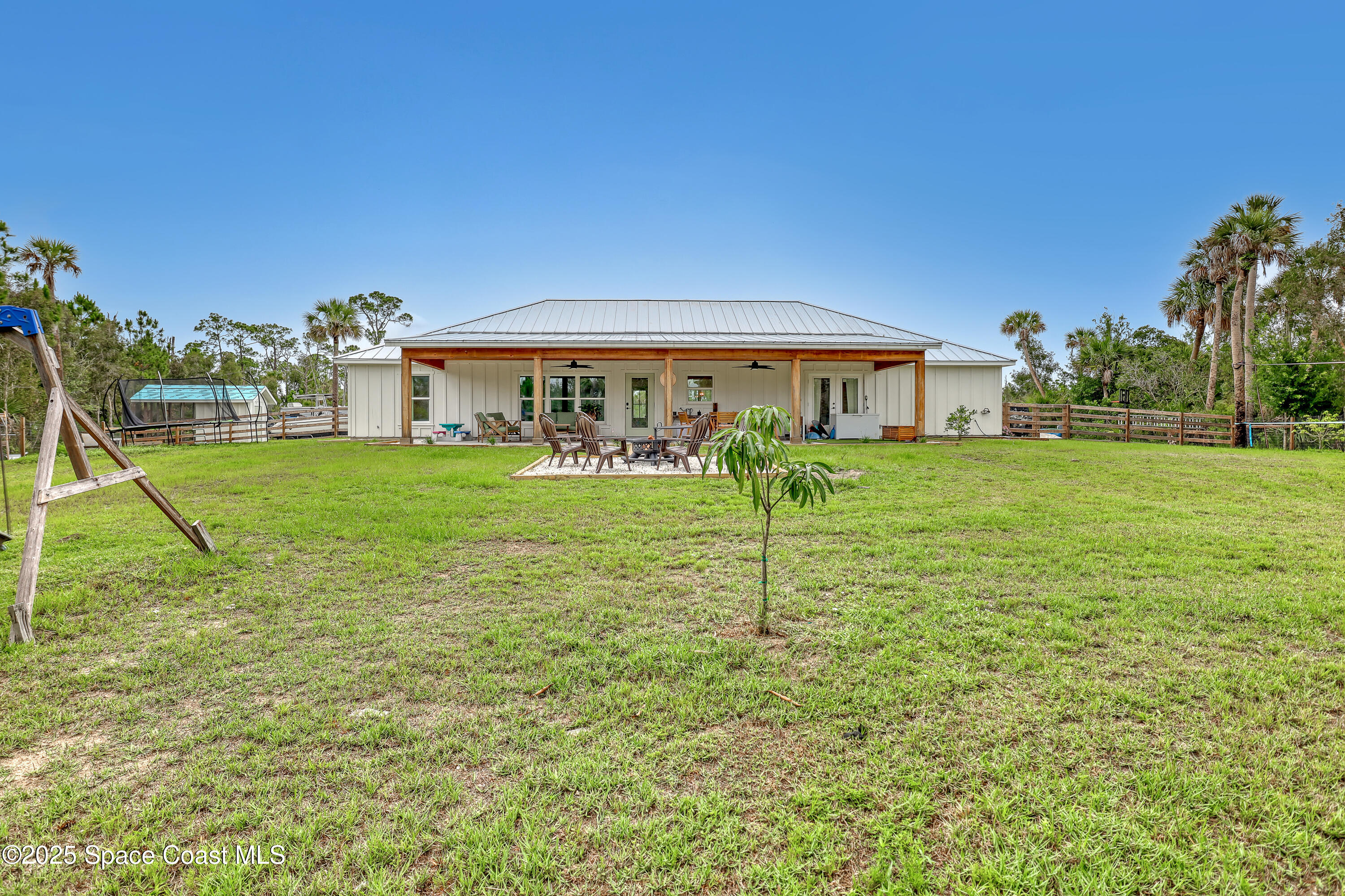 3350 Leghorn Road Malabar, FL 32950 - Photo 42 of 55 a view of a house with a yard