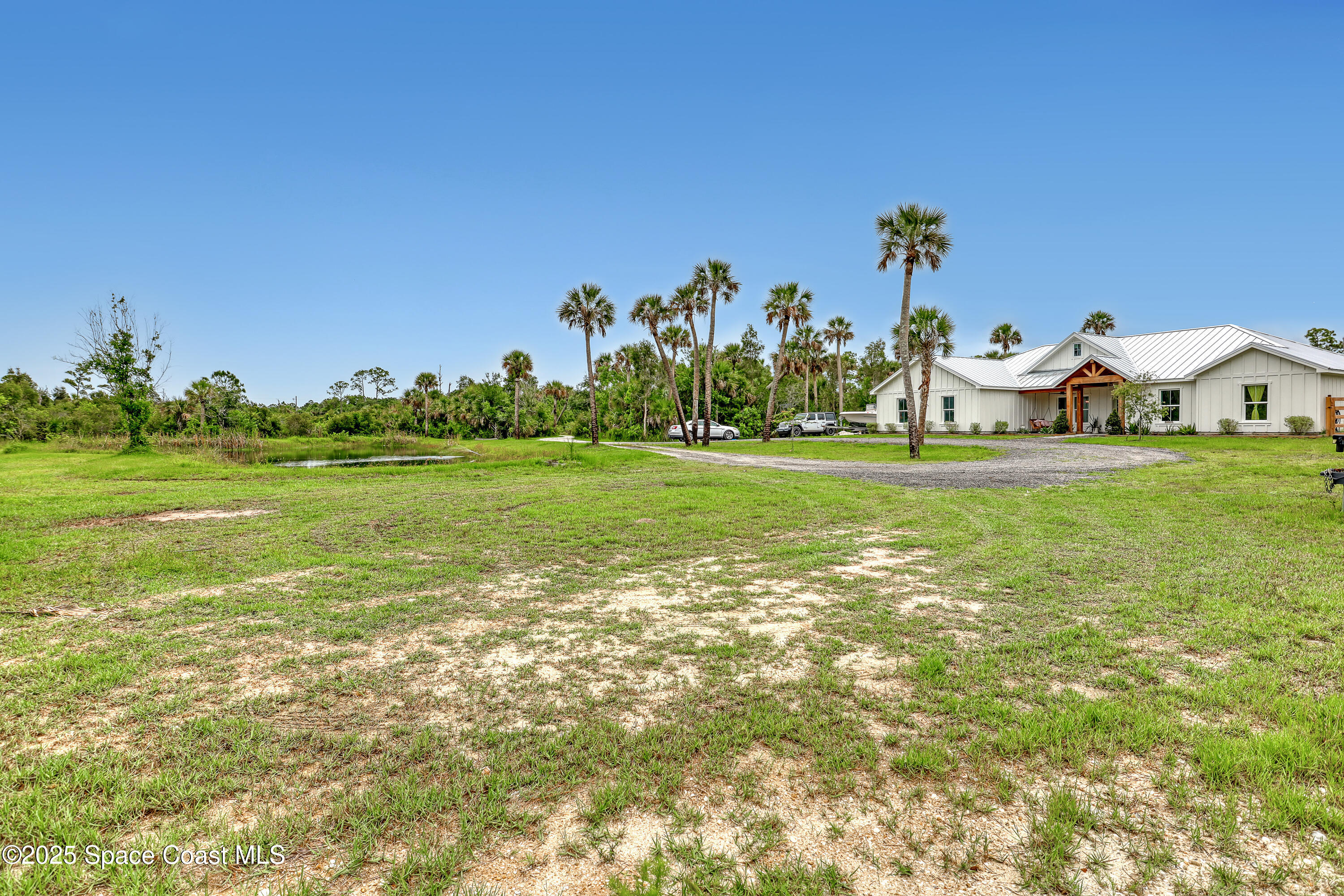 3350 Leghorn Road Malabar, FL 32950 - Photo 46 of 55 a view of a big yard with a house