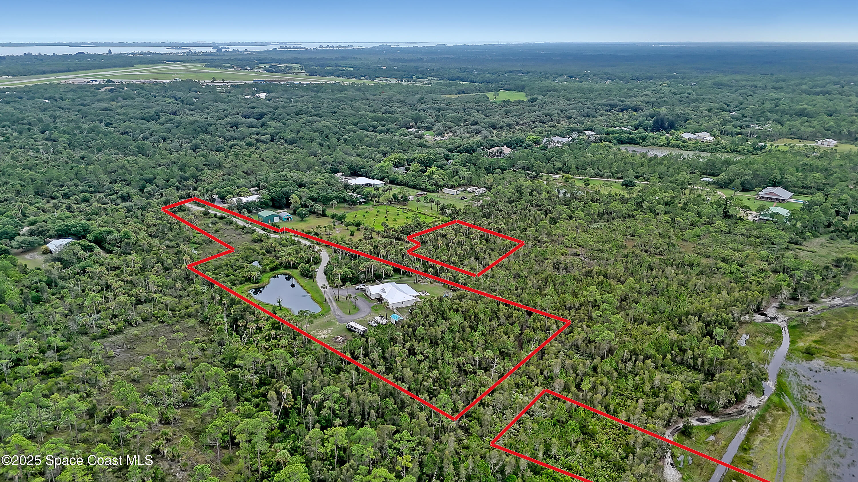 3350 Leghorn Road Malabar, FL 32950 - Photo 48 of 55 an aerial view of a houses with a yard