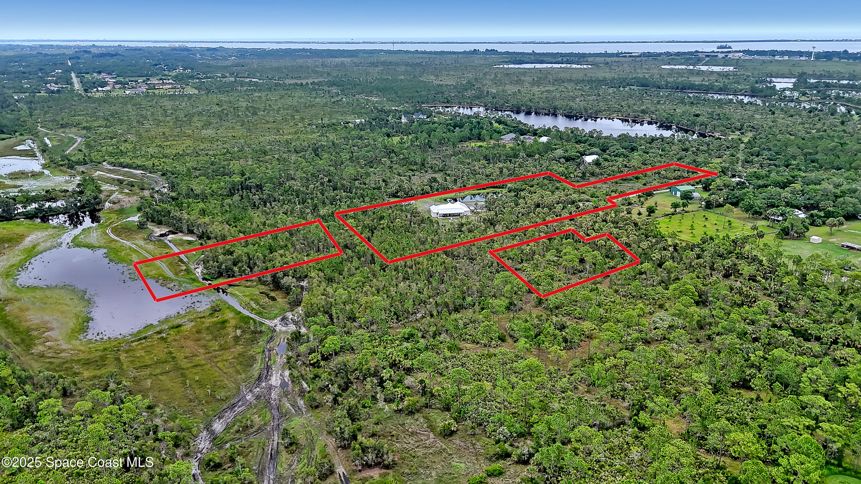 3350 Leghorn Road Malabar, FL 32950 - Photo 50 of 55 an aerial view of residential houses with outdoor space and trees
