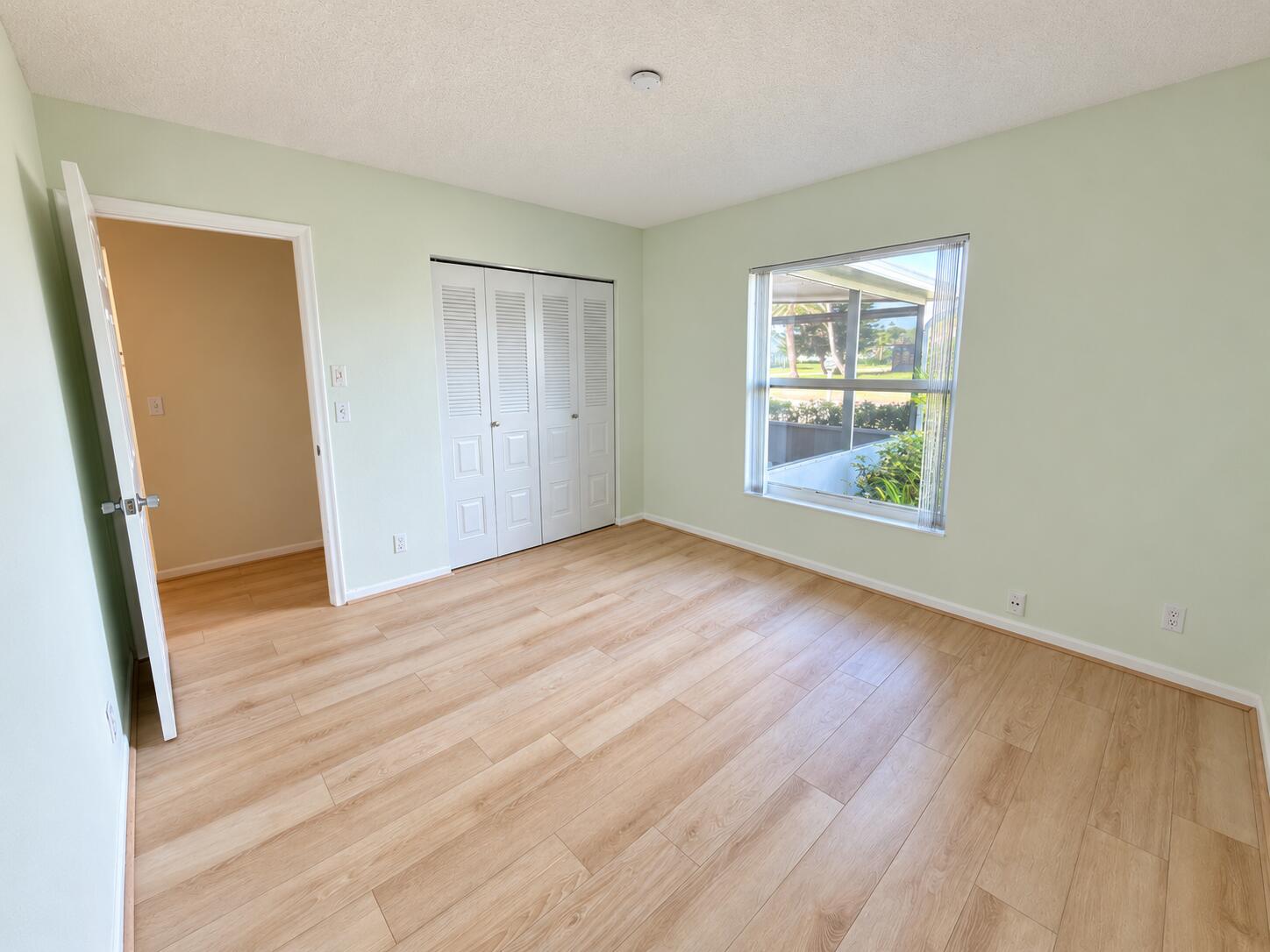 6309 Dusenburg Road Delray Beach, FL 33484 - Photo 13 of 26 Brightened mint bedroom, clutter-free co