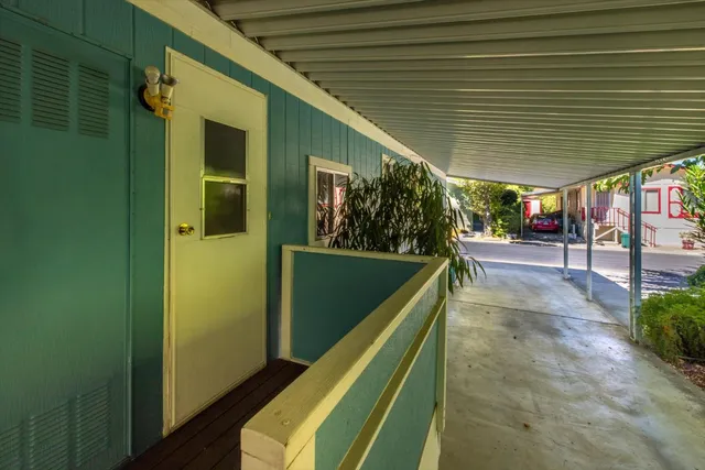 a lobby with furniture and flowers