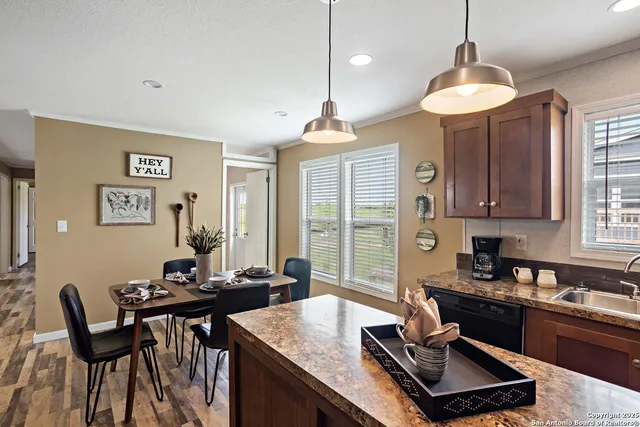 a kitchen with a table and chairs in it